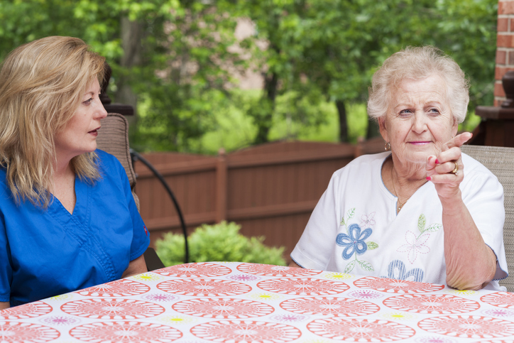 A caregiver works on communication methods with an Aphasic client. It can be a challenge for all when a loved one has Aphasia.