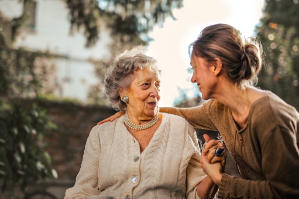 A loved one with aphasia may struggle to talk with their family members as this woman struggles to chat with her daughter.